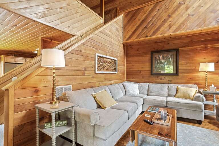 Living Room with Comfortable Sectional Situated Around the TV and Wood Burning Fireplace Living Room with Comfortable Sectional Situated Around the TV and Wood Burning Fireplace