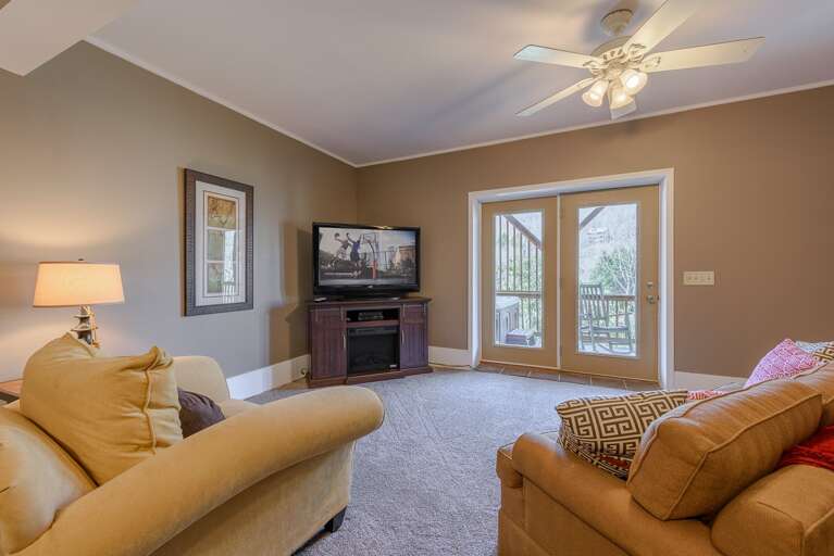 Downstairs Den with Huge HDTV and Glass Doors out onto Deck