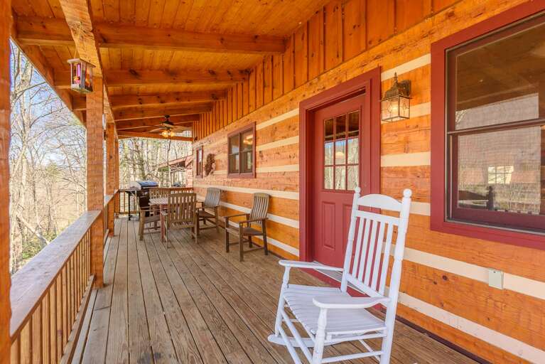Enjoy Lake and Mountain Breezes while Rocking or Dining Outside on the Deck
