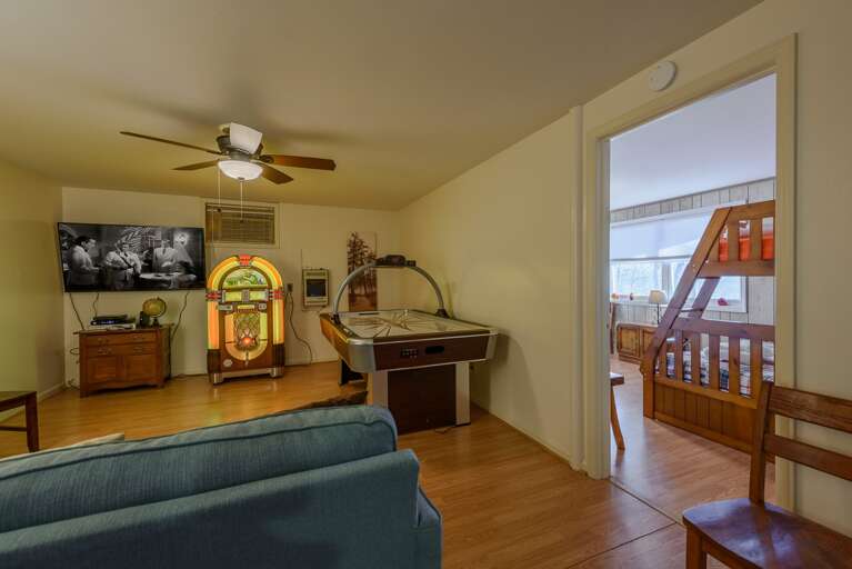 Downstairs Den and Game Room with Jukebox, Air Hockey, and Huge HDTV