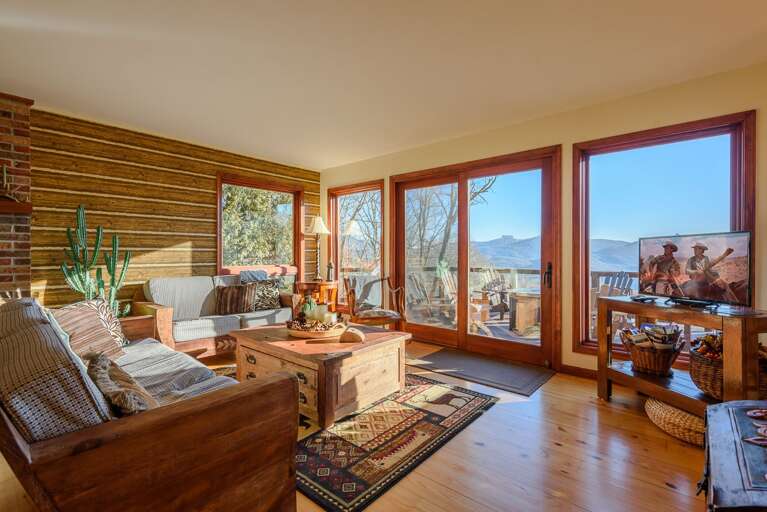 Great Room with HDTV, Wall of Windows framing Mountain Views