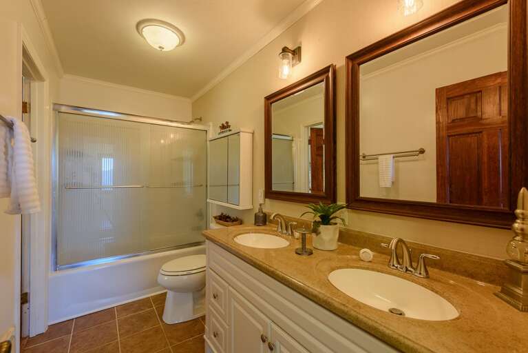 Main Level Bathroom with Granite Double Vanity, Tub/Shower