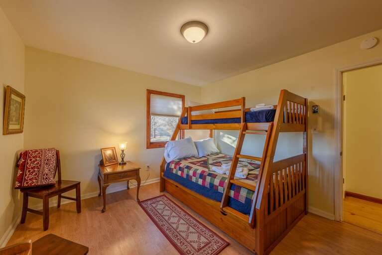 Main Level Bunk Bedroom with Twin over Full Bunk Bed, and Twin Trundle Bed beneath