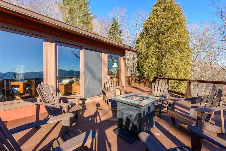 Open Air Patio with Adirondack Seating and Fire Table