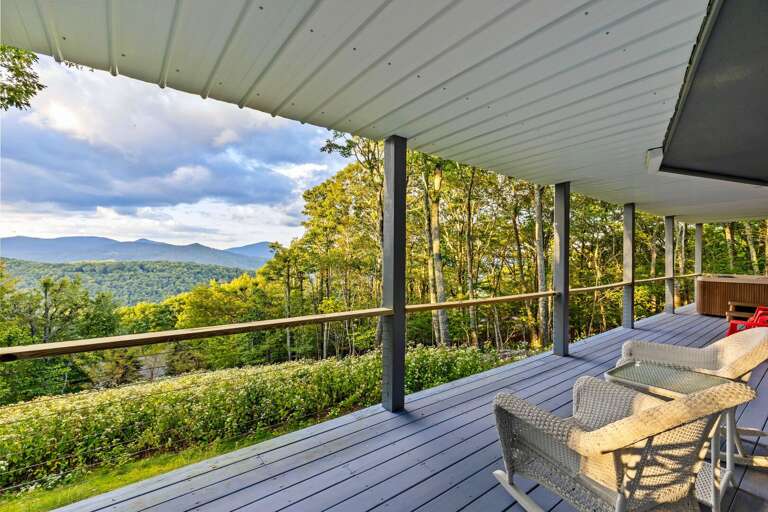 Lower Level Deck with Table, Chairs, and Hot Tub
