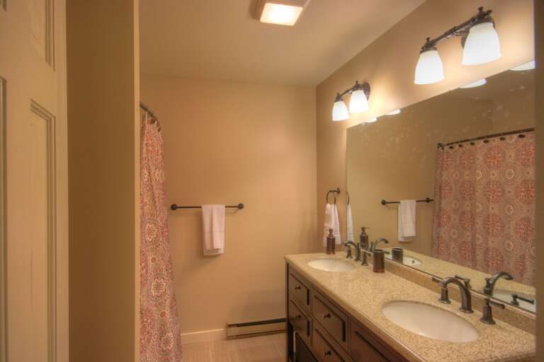 Majestic Mountain Haus Ensuite Full Bathroom with Double Vanity