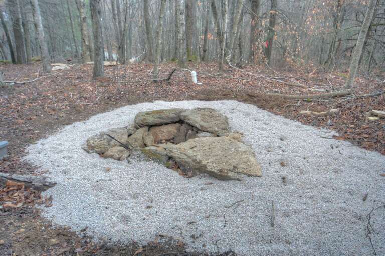 Majestic Mountain Haus Fire Pit lined with Native Stones