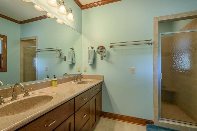 Master Bathroom Includes Large Tiled Walk-In Shower and Dual Vanities