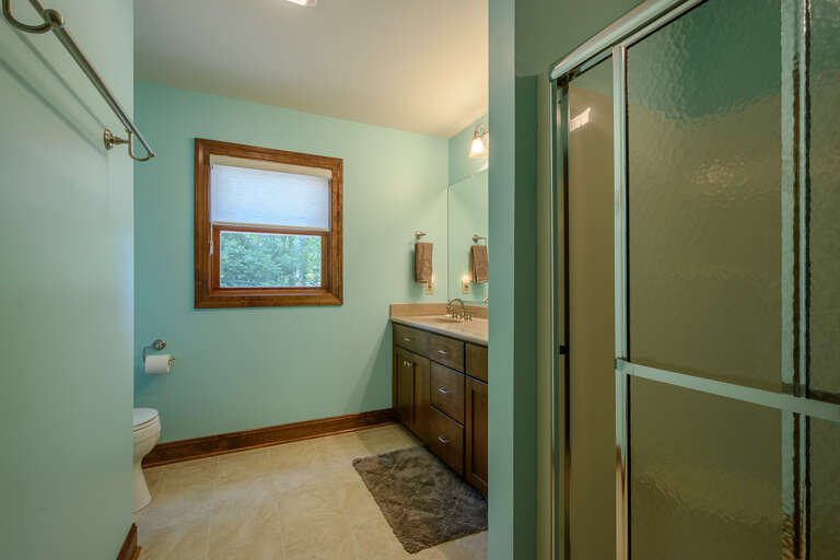 Shared Bathroom on Lower Level Includes Walk-In Shower and Dual Vanities