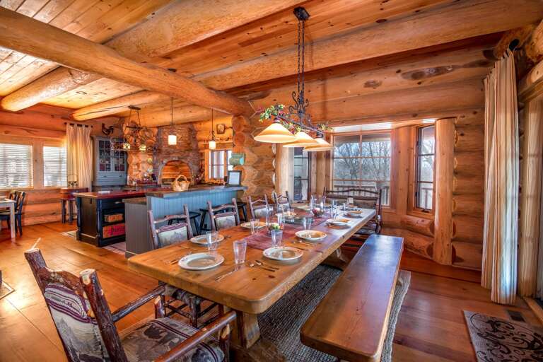 Dining table seats up to 14, with additional seating at the bar