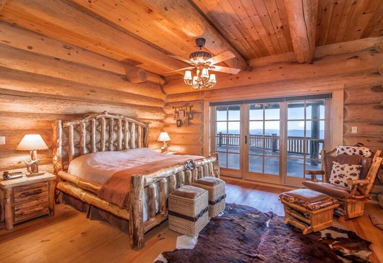 Log king bed in master suite