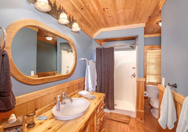 One of two upstairs full bathrooms, each with shower and towel warmer