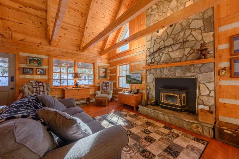 Living Area with Wood-Burning Fireplace and TV