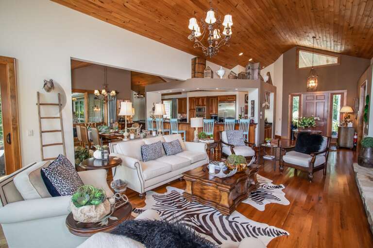 Living Room with Open Floor Concept Leading to Kitchen and Dining