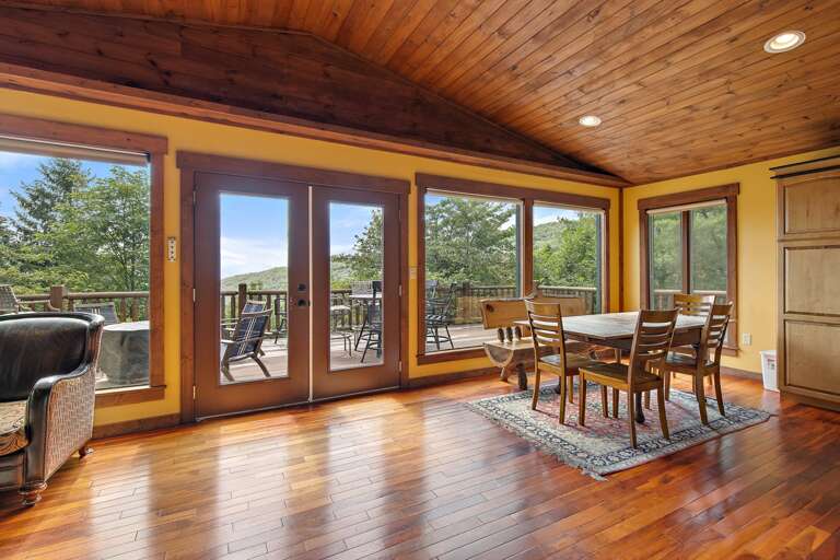 Tongue and Groove Ceilings and Wood Floors, with Wall of Windows