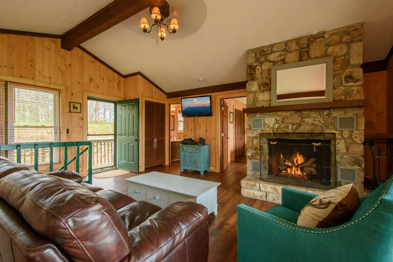 Living Room Features a Large Gas Fireplace and Comfy Seating Living Room Features a Large Gas Fireplace and Comfy Seating