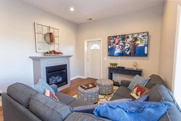 Gas fireplace and flat-screen TV in downstairs living area