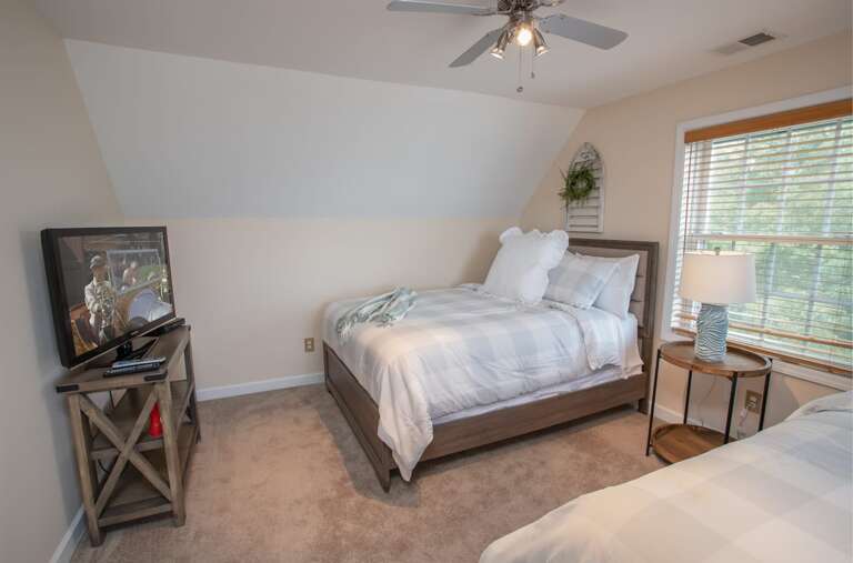 Queen bedroom with flatscreen TV