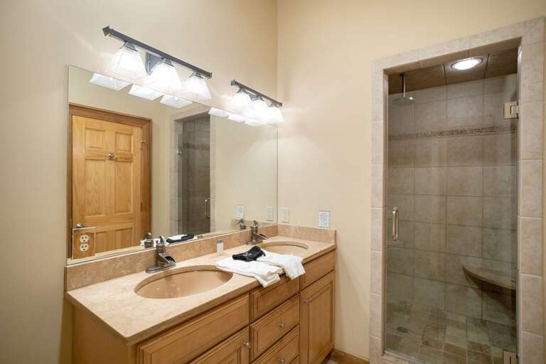 Tile Shower and Dual Vanities in the Master Bathroom