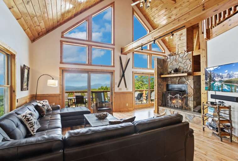 Flat Panel Smart TV and Wood Burning Fireplace in Open Concept Living Area Flat Panel Smart TV and Wood Burning Fireplace in Open Concept Living Area