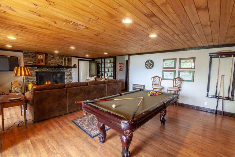 Slate Pool Table, Dart Board, and Leather Sectional Sofa in Downstairs Den and Game Room Slate Pool Table, Dart Board, and Leather Sectional Sofa in Downstairs Den and Game Room