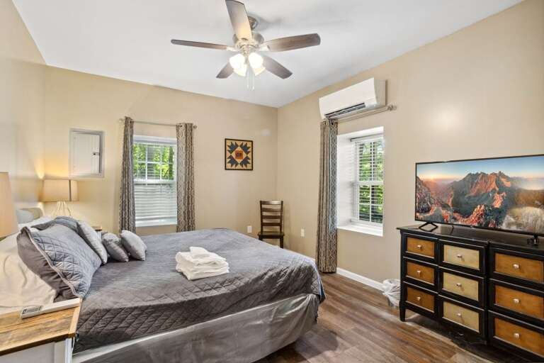 King Bed in the Lower Level Bedroom with a TV King Bed in the Lower Level Bedroom with a TV