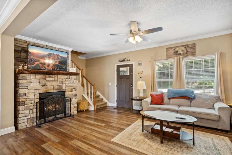 Mounted Big Screen TV above the Stacked Stone Fireplace Mounted Big Screen TV above the Stacked Stone Fireplace