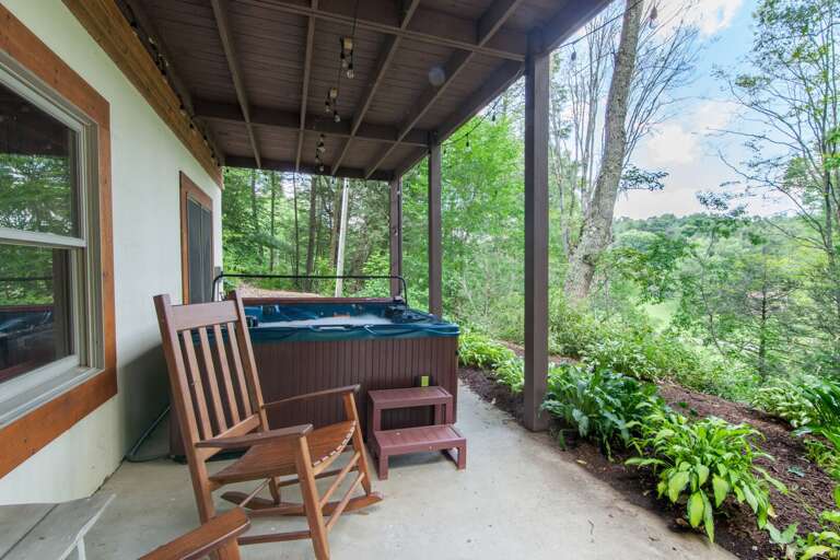 Courtyard off of Lower Level with Hot Tub and Rocking Chairs Courtyard off of Lower Level with Hot Tub and Rocking Chairs