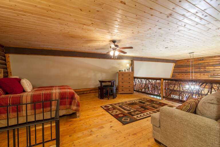 Huge Upstairs Loft with Queen Bed and Sitting Area with Custom Branch and Log Banister which looks down onto Main Level Huge Upstairs Loft with Queen Bed and Sitting Area with Custom Branch and Log Banister which looks down onto Main Level