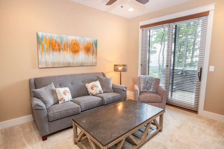 Downstairs Den with Comfy Furniture and Large HD Smart TV, Glass Door out onto Deck with Hot Tub Downstairs Den with Comfy Furniture and Large HD Smart TV, Glass Door out onto Deck with Hot Tub