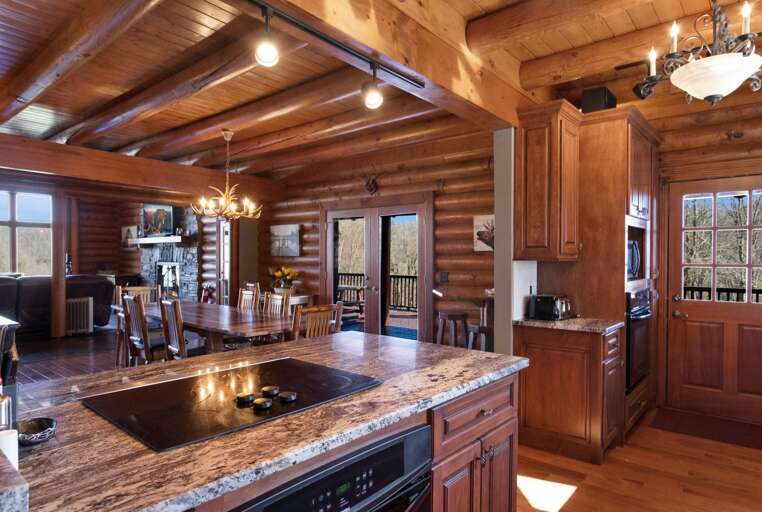 Kitchen With Lots of Counter Space, Opens to Dining, Deck, Entry Hall and Parking Area