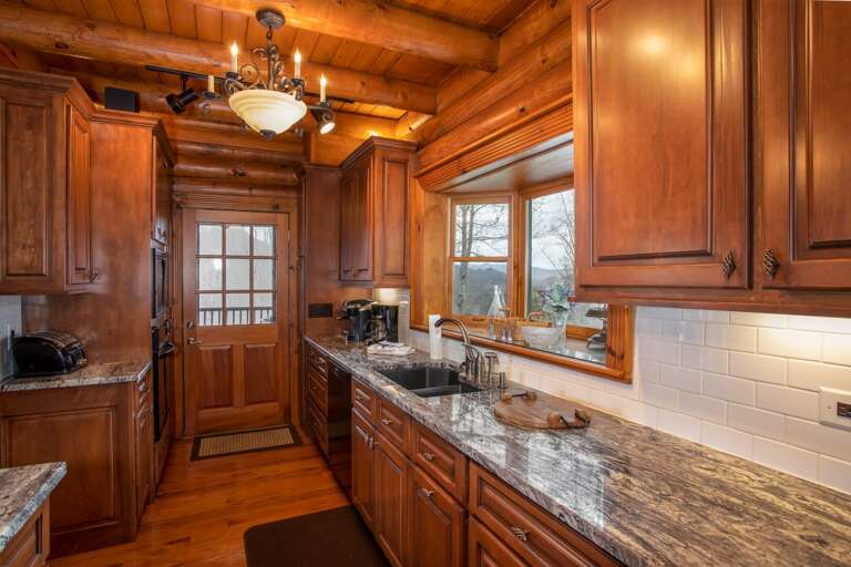 Kitchen With Lots of Counter Space, Opens to Dining, Deck, Entry Hall and Parking Area