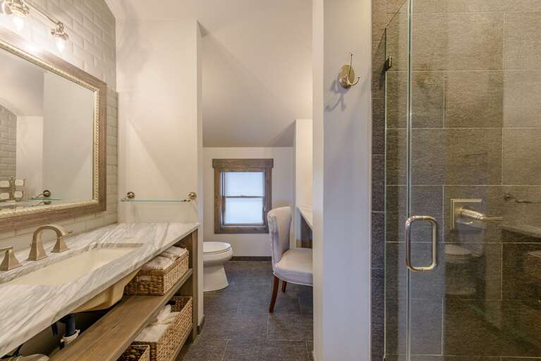 Private Ensuite Master Bathroom with Marble Vanity and Heated Tile Floors