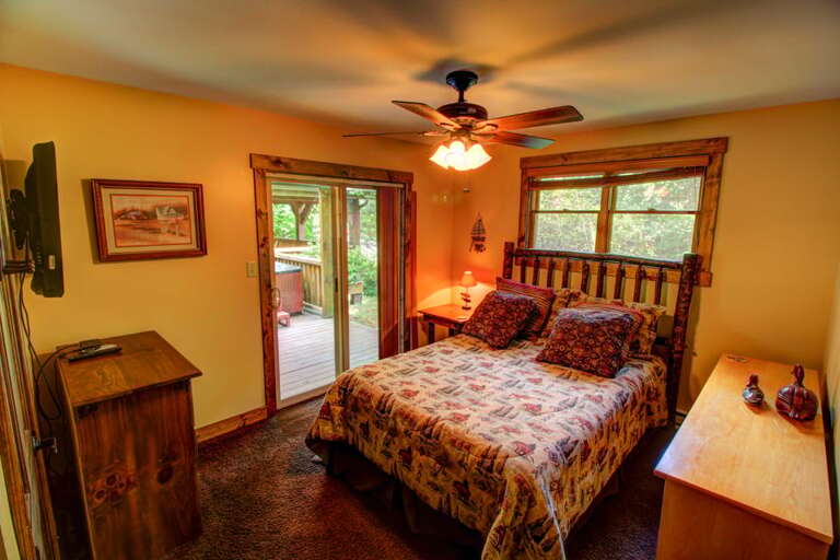 Main Floor Queen Bedroom with Deck Access