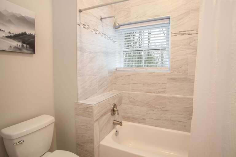 Tub and Shower Combo in the Lower Level Bathroom Tub and Shower Combo in the Lower Level Bathroom