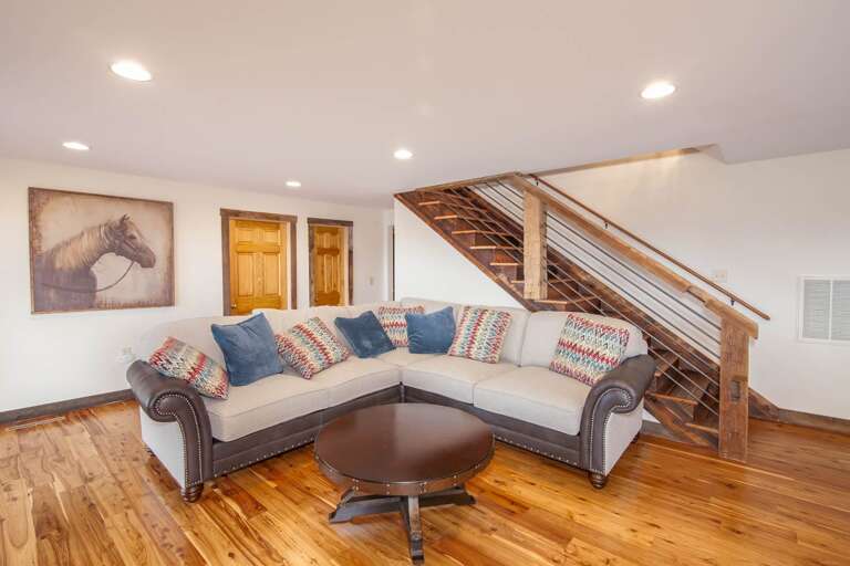 Den on Middle Level with Sectional Sofa and Wood Floors Den on Middle Level with Sectional Sofa and Wood Floors