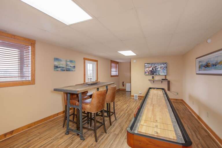 Game Room on Lower Level with Table & Chairs and Bar Nook with Sink Game Room on Lower Level with Table & Chairs and Bar Nook with Sink