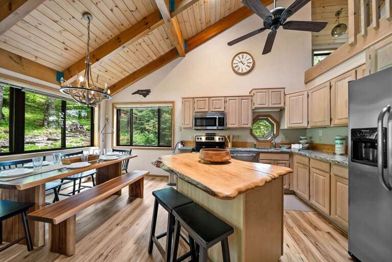 Kitchen with Granite Counters, Stainless Appliances and Custom-Crafted Live Edge Wood Island with Additional Seating