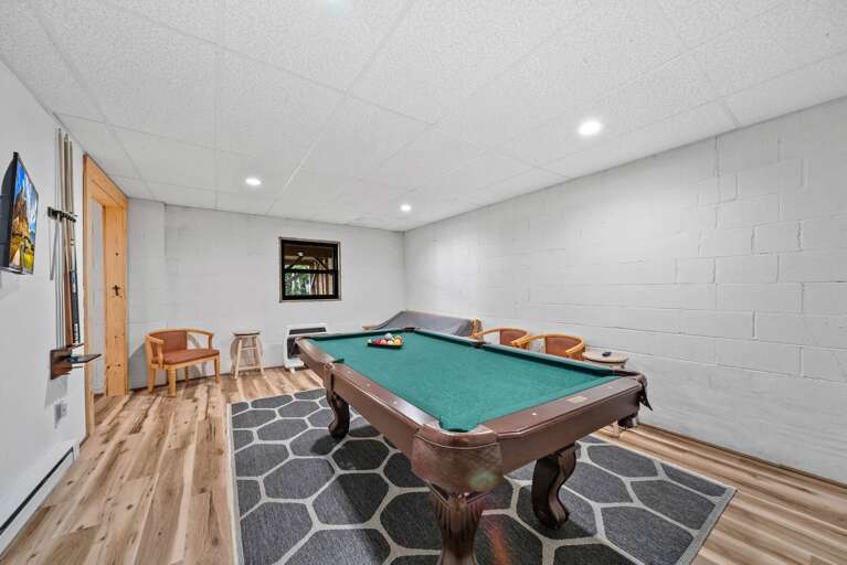 Pool Table, Futon and TV in the Lower Level Game Room