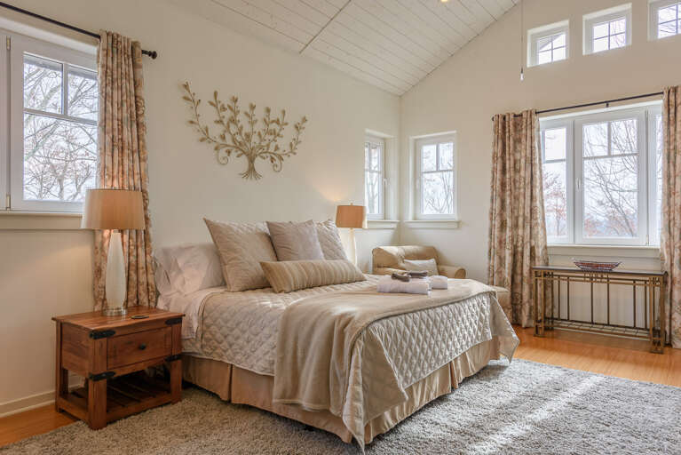 Master Bedroom with King Bed, Armchair, Tons of Windows Letting in Sunlight! Master Bedroom with King Bed, Armchair, Tons of Windows Letting in Sunlight!