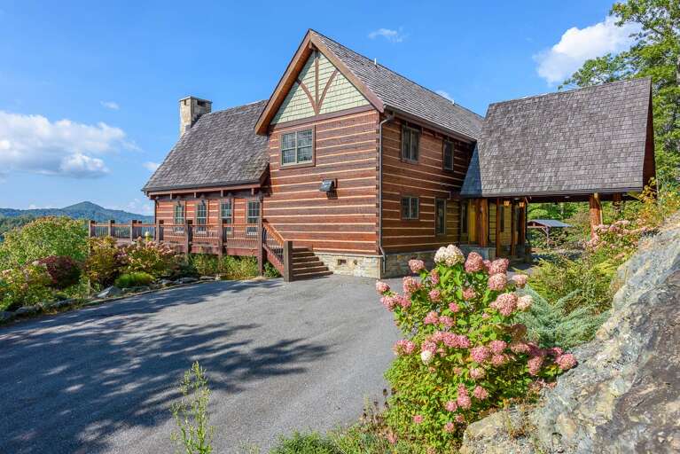 The driveway to the house is paved, very steep, with sharp curves, and is about 1/8 mile long.