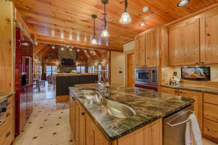 Kitchen has Granite Countertops and Custom Cabinetry