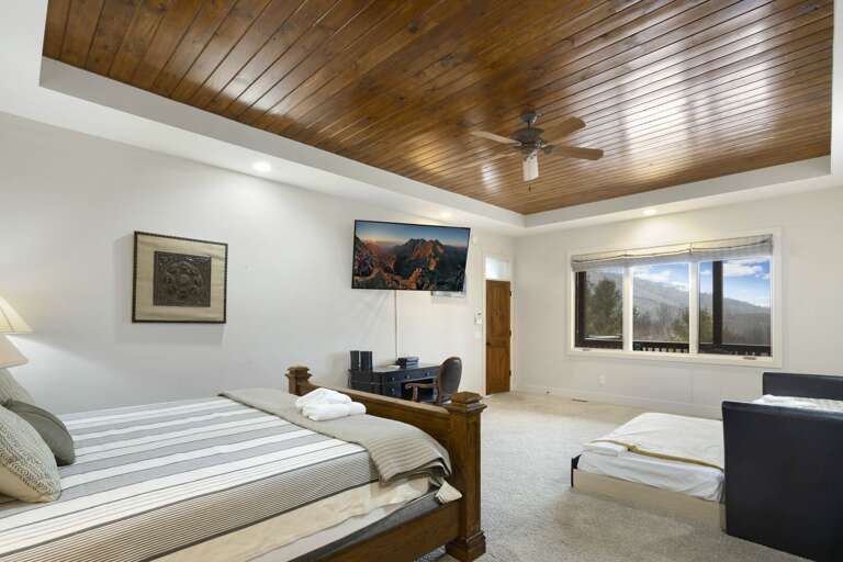 Twin Daybed and Twin Trundle Bed offer Extra Sleeping in Master Suite with Mountain Views