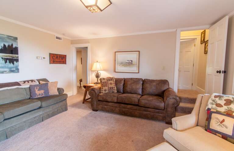 Downstairs Den with Leather Queen Sleeper Sofa, and Twin Roll-out Bed for Additional Sleeping Options