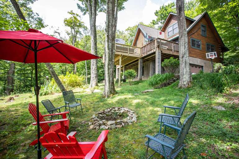 Wood-burning Fire pit in the Back Yard with Shade and Seating Wood-burning Fire pit in the Back Yard with Shade and Seating