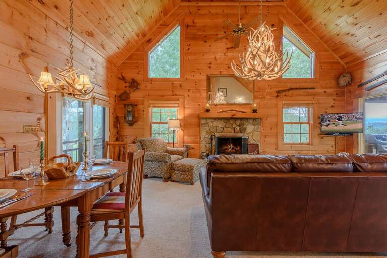 Great Room and Dining Area boast Vaulted Ceilings, Antler Chandeliers, and Lots of Room to Relax! Great Room and Dining Area boast Vaulted Ceilings, Antler Chandeliers, and Lots of Room to Relax!