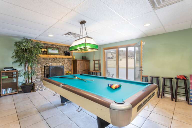 Pool Table and Exit to Back Yard Leading to the Waters Edge