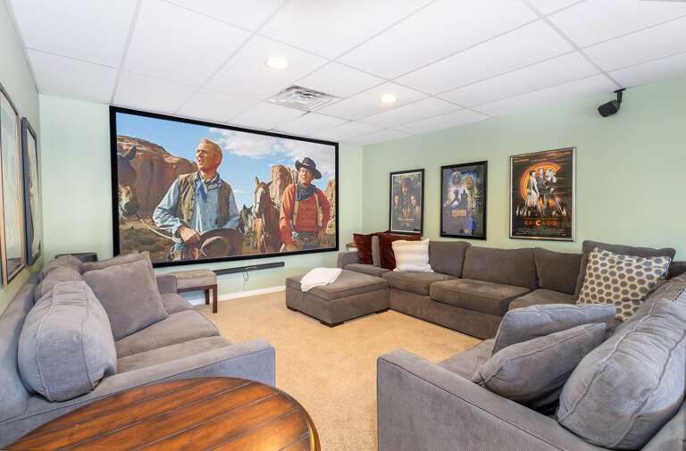 Theater Area with Projector TV, Surround Sound, and Lots of Comfy Seating