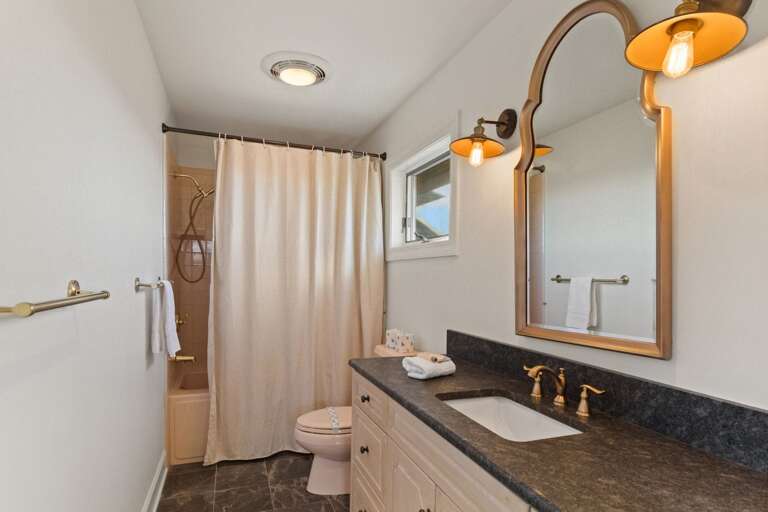 Ensuite Full Bathroom with Tub/Shower Combo and Large Vanity in the King Bedroom