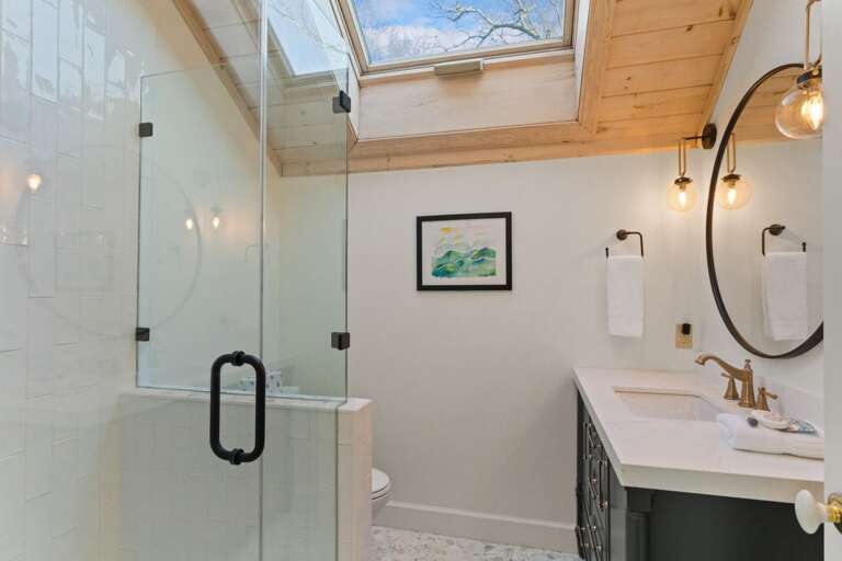 Full Upstairs Bathroom with Step in Shower and Large Skylight